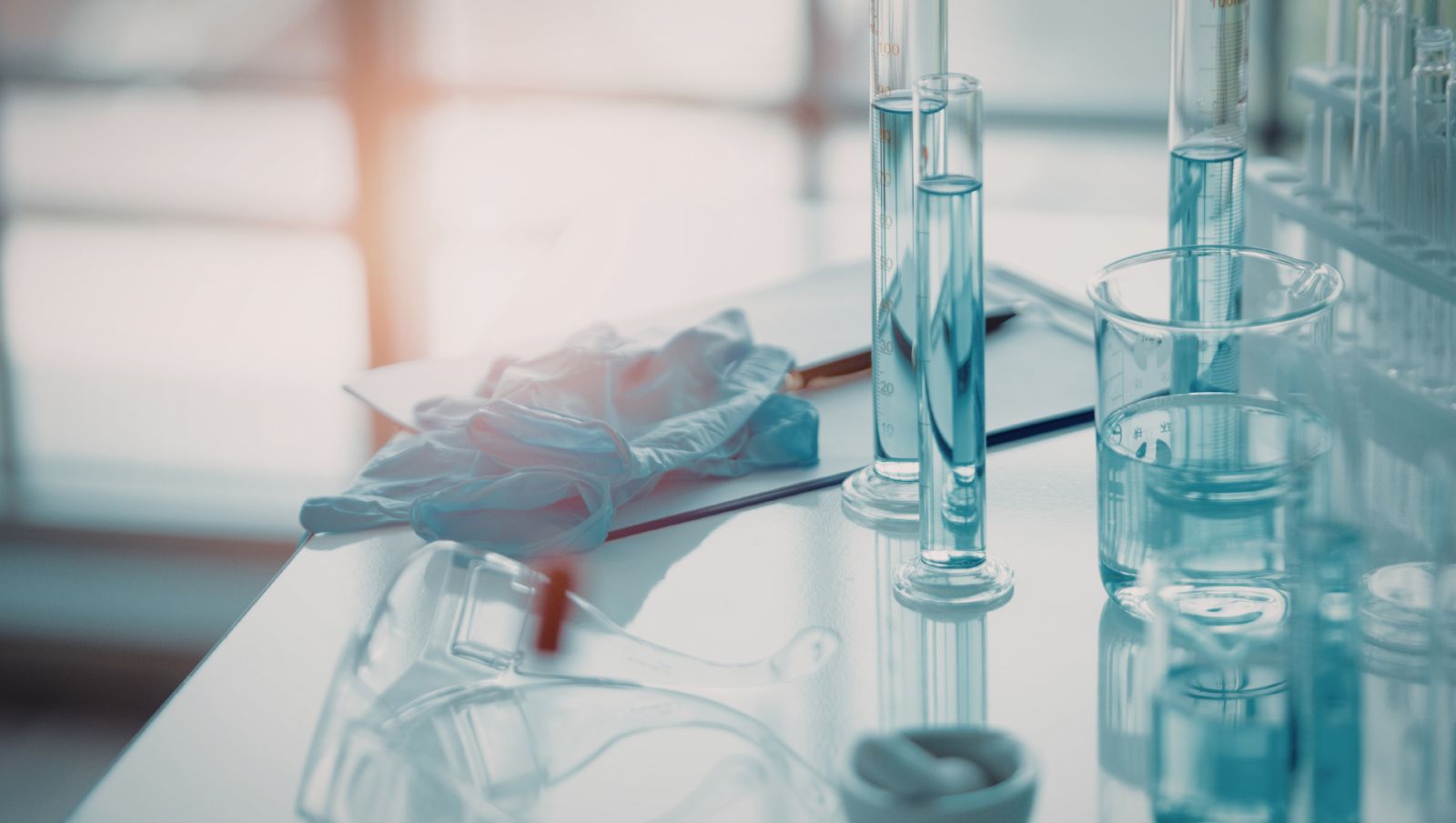 A scientist in a laboratory looking into a microscope to analyze cannabis plant compounds like terpenes and flavonoids.
