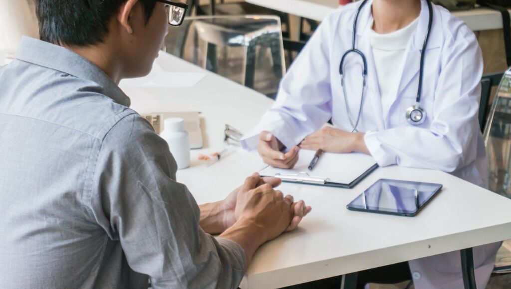 A Crohn's disease patient in Alabama consulting with a state-registered certifying physician about medical cannabis qualifications.
