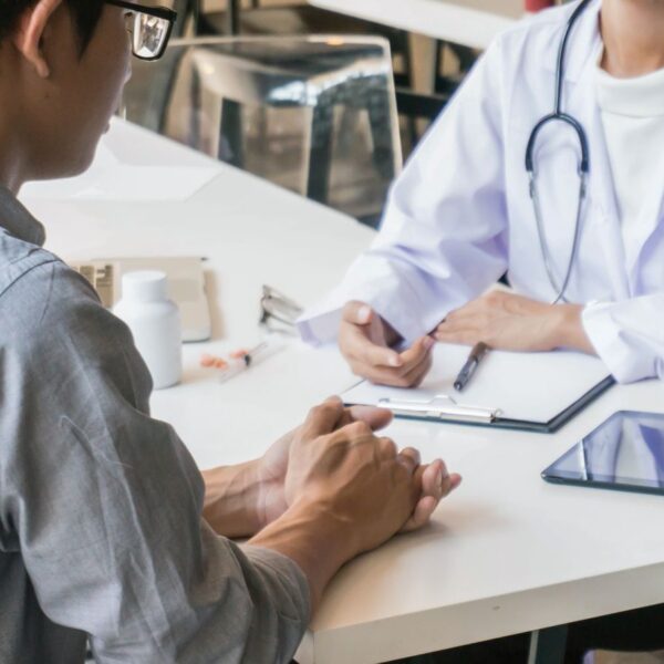 A Crohn's disease patient in Alabama consulting with a state-registered certifying physician about medical cannabis qualifications.
