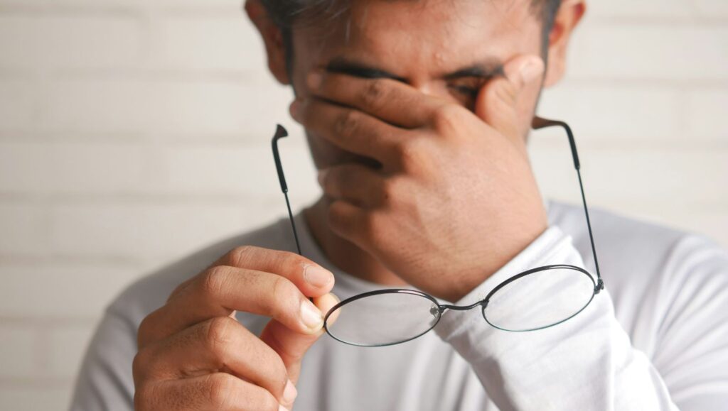 A middle aged man in Alabama looking visibly tired and hopeless while dealing with refractory chronic pain symptoms.