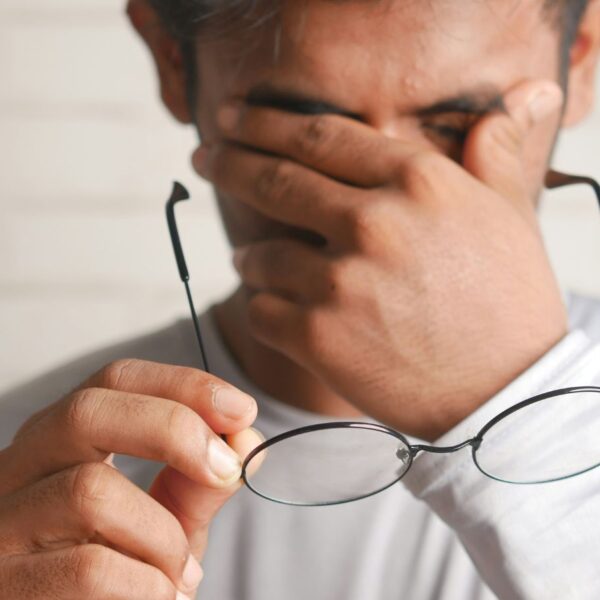 A middle aged man in Alabama looking visibly tired and hopeless while dealing with refractory chronic pain symptoms.