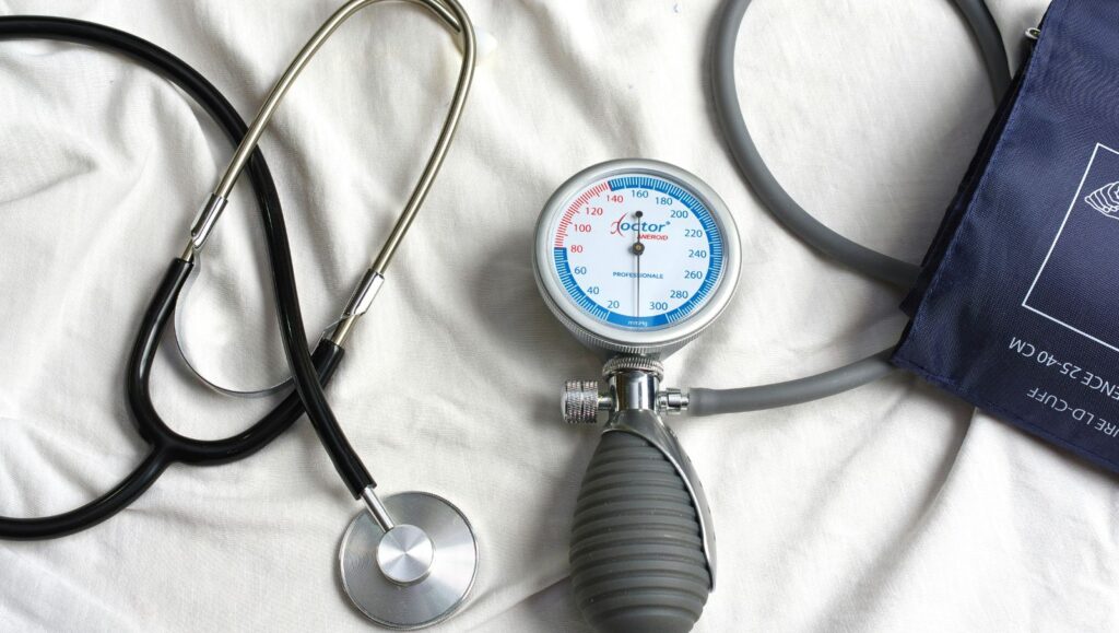 Close-up of a stethoscope and clinical instruments on a physician's desk